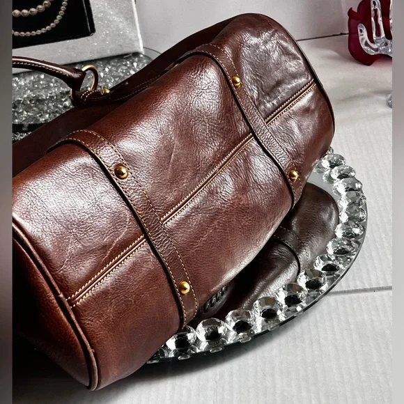 Dooney & Bourke florentina Italian Vacchetta leather handbag or crossbody